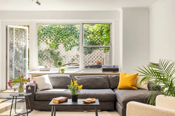 a living room with furniture and a large window
