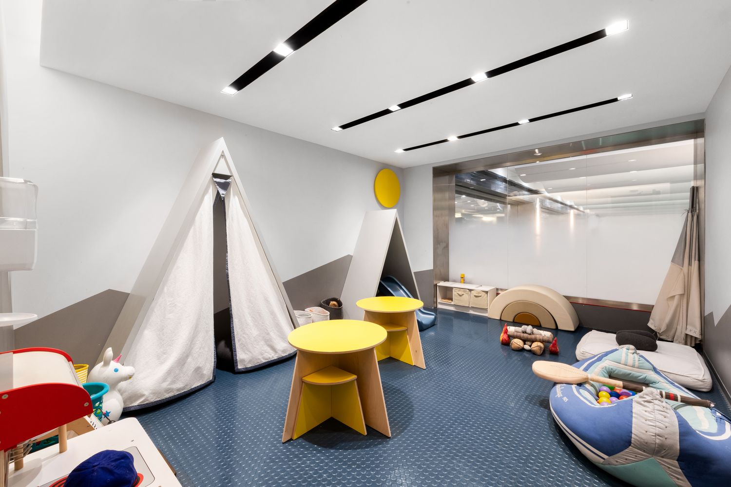 70 Charlton Street, Unit 19D Manhattan, NY 10014 - Photo 12 of 14 a living room with furniture and a wooden floor