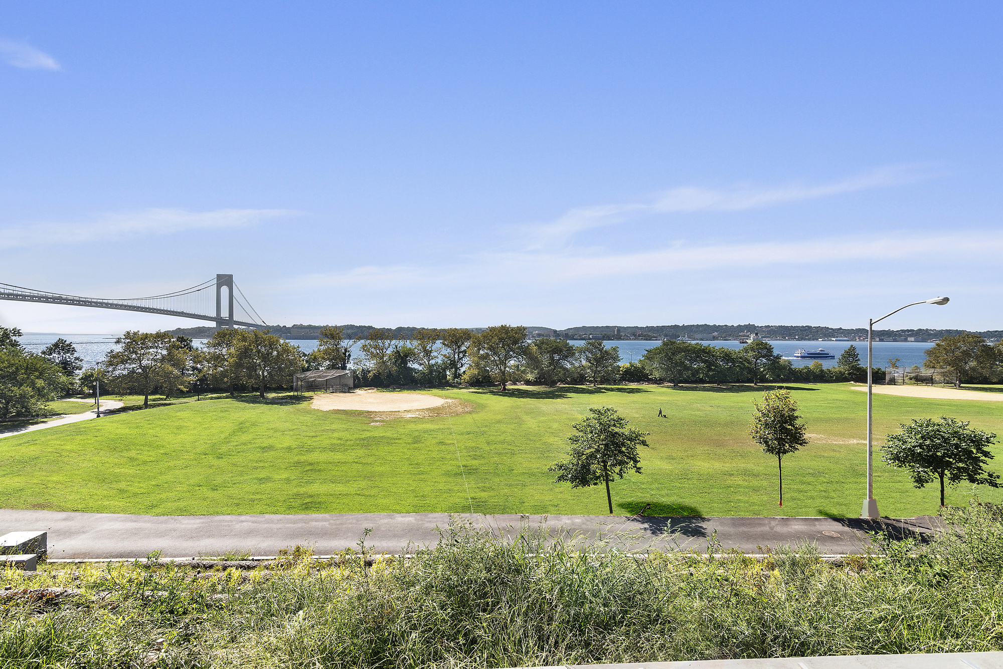9201 Shore Road, Unit B301 Brooklyn, NY 11209 - Photo 9 of 12 a view of a lake with a beach