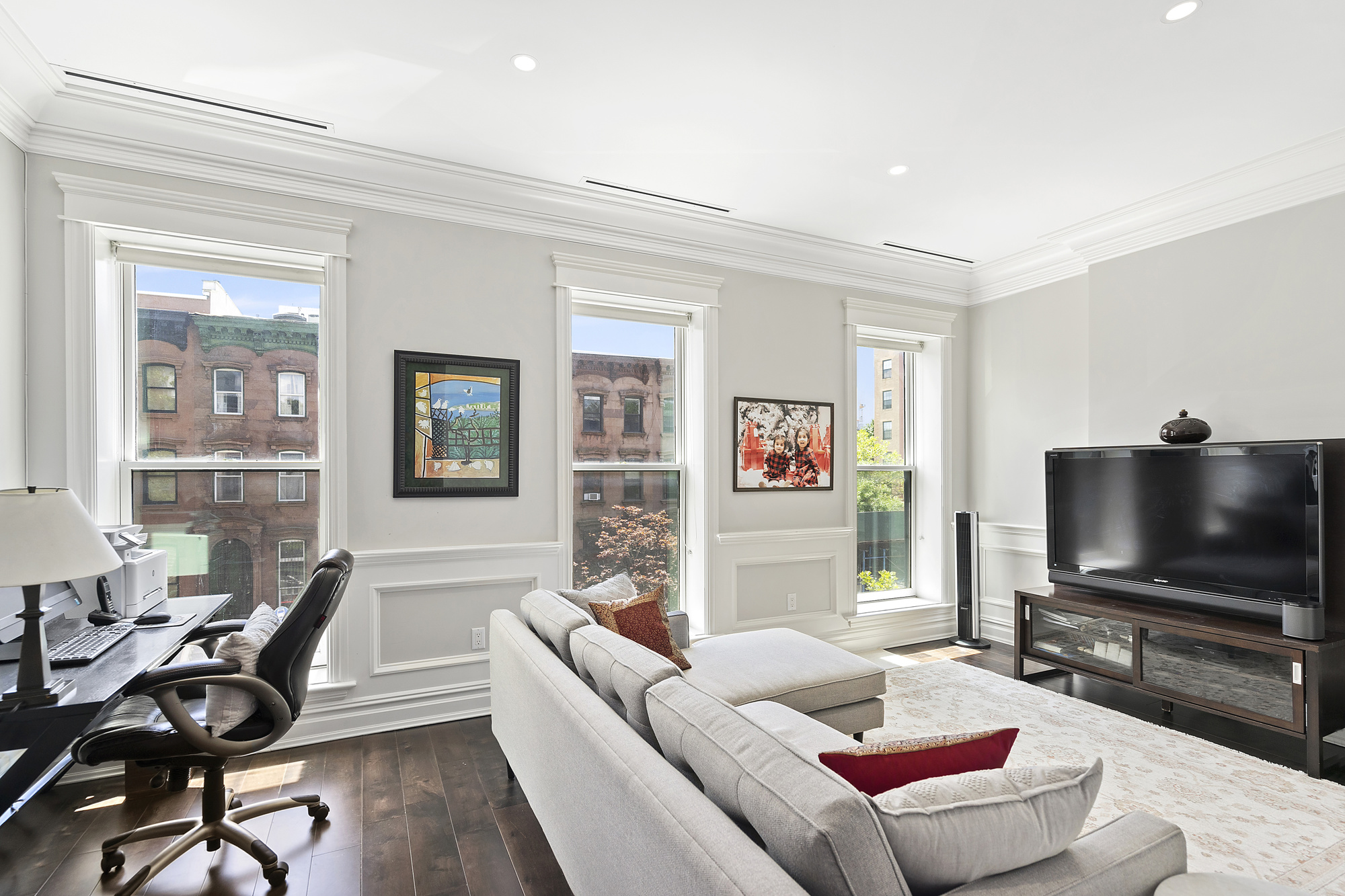 67 Greene Avenue, Unit 2 Brooklyn, NY 11238 - Photo 8 of 15 a living room with furniture and a flat screen tv