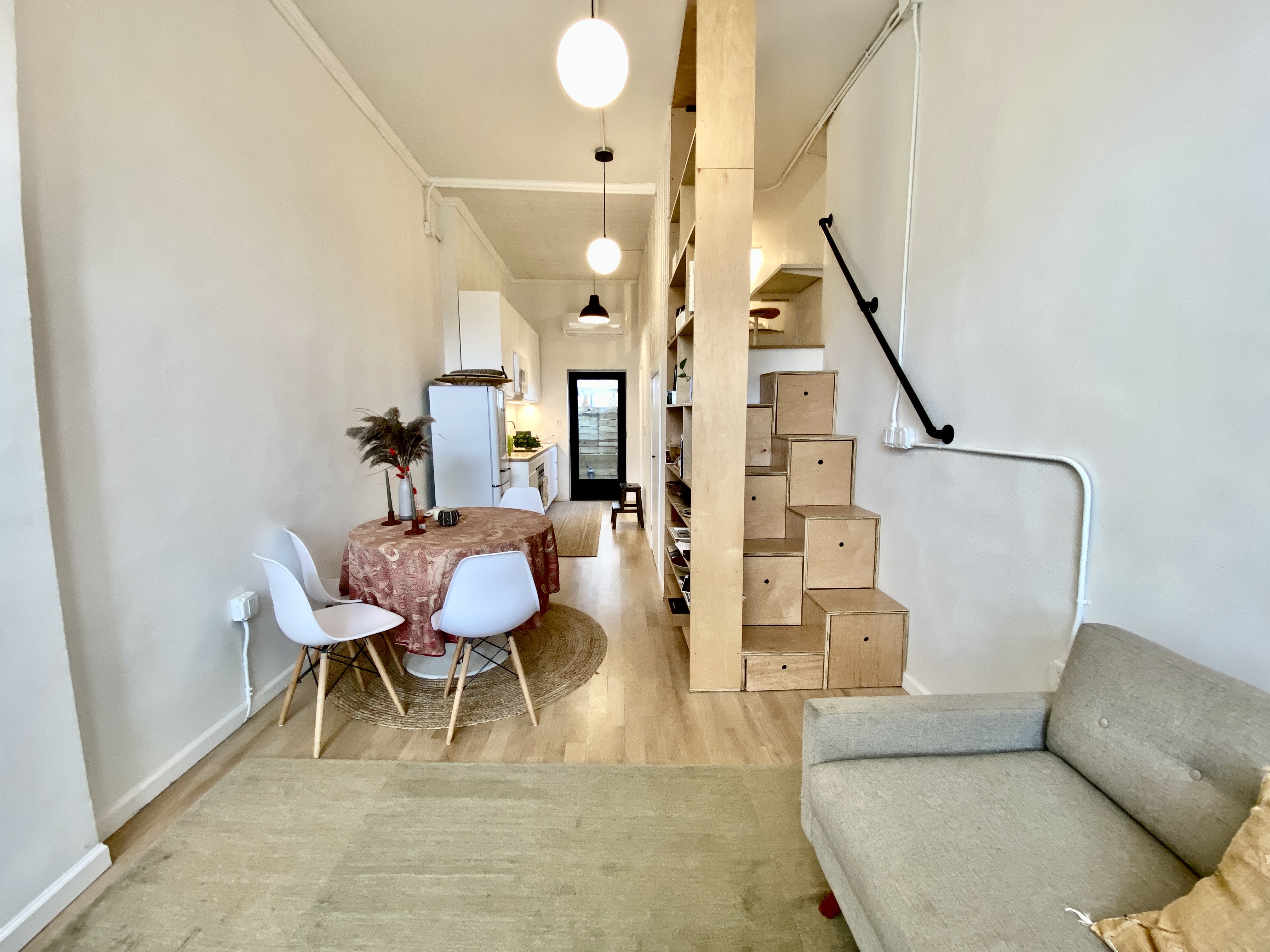 409 Smith Street, Unit 1 Brooklyn, NY 11231 - Photo 3 of 9 a living room with furniture and a wooden floor