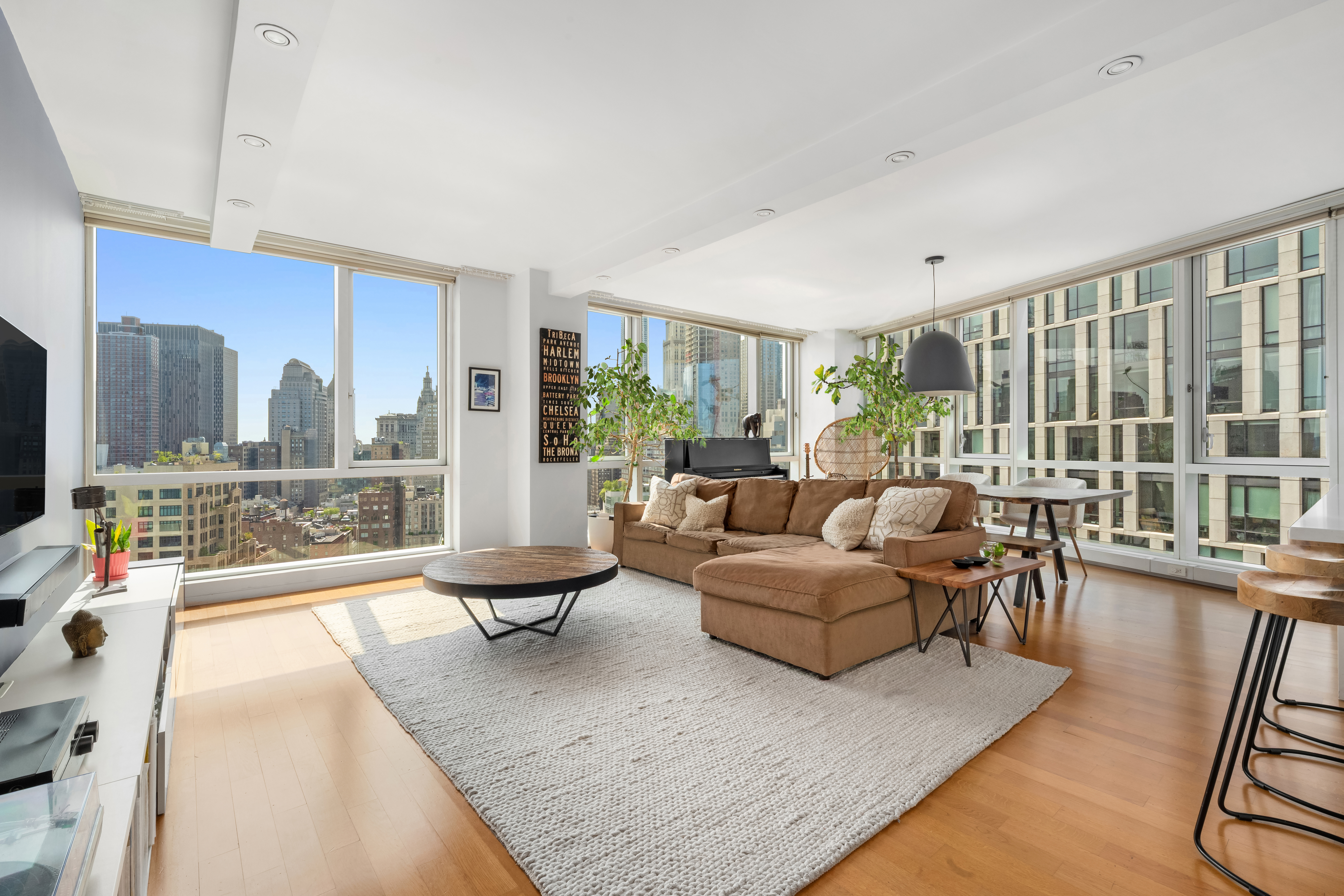 200 Chambers Street, Unit 25F Manhattan, NY 10007 - Photo 2 of 13 a living room with furniture and a large window