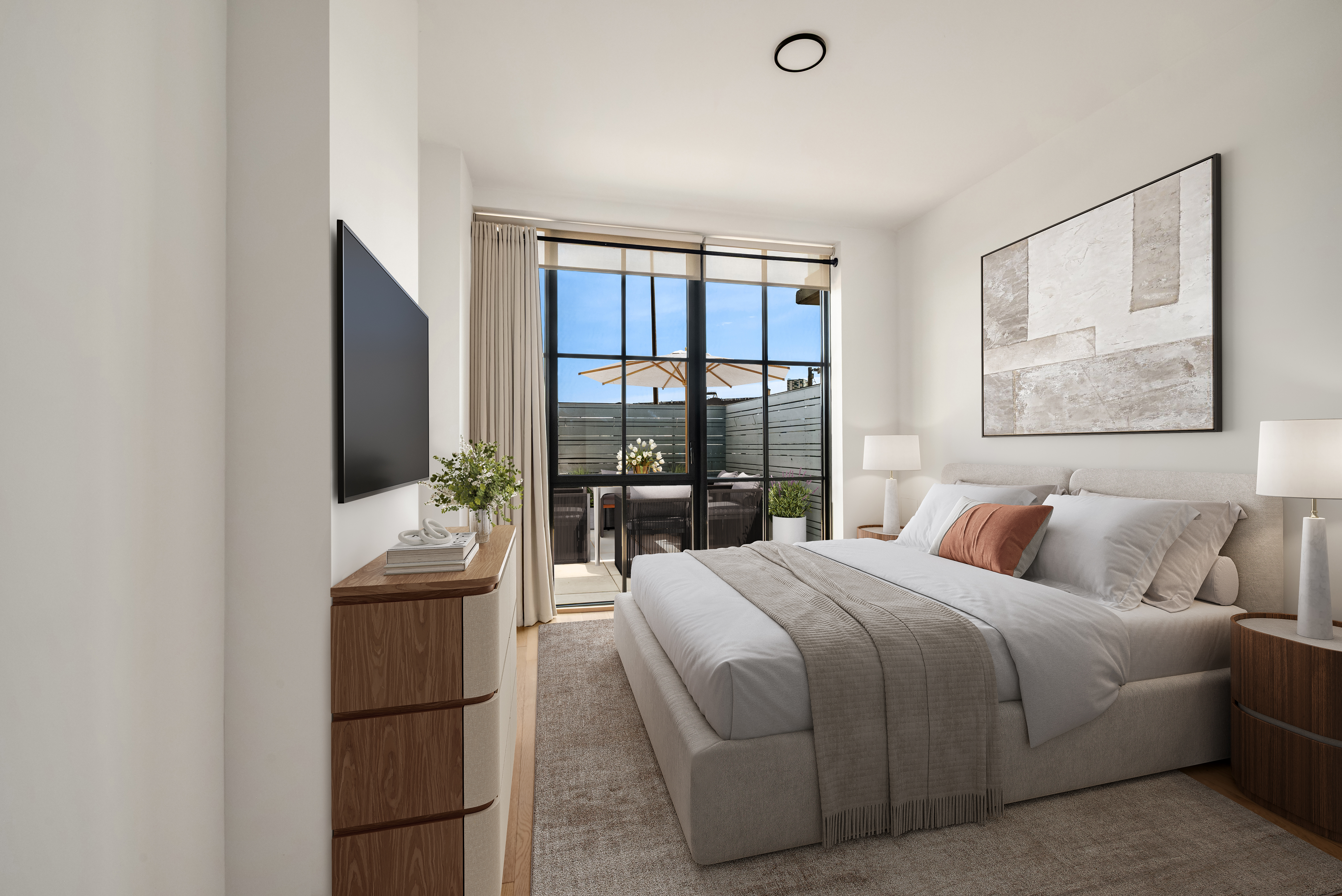 24-22 Jackson Avenue, Unit 311 Queens, NY 11101 - Photo 8 of 16 a bedroom with a balcony a bed and a flat screen tv