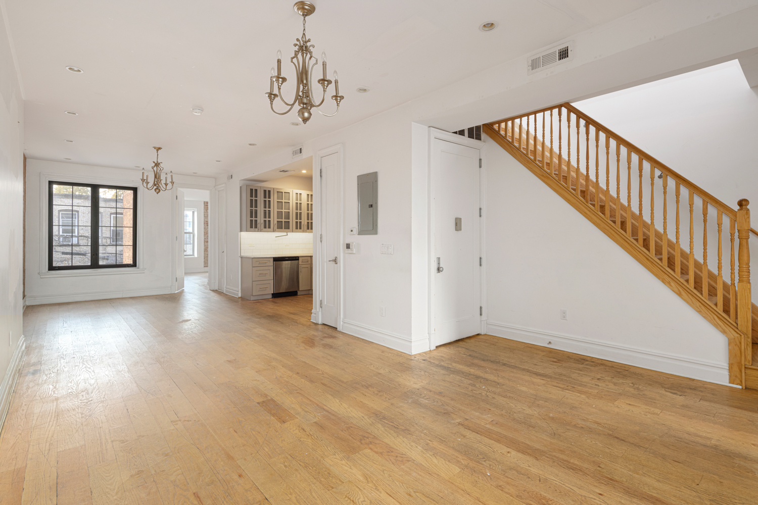 912 Eastern Parkway, Unit 1 Brooklyn, NY 11213 - Photo 2 of 11 a view of a hallway with wooden floor and staircase