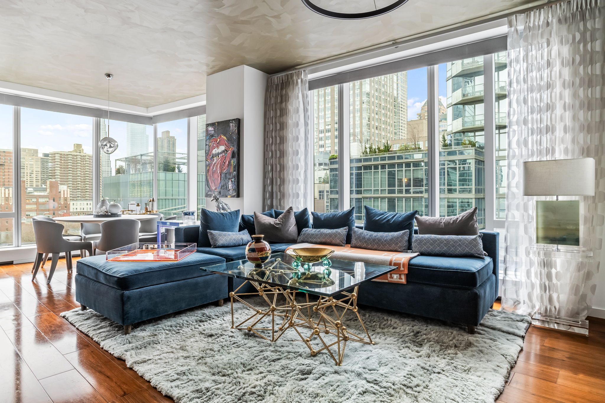 1 West End Avenue, Unit 9D Manhattan, NY 10023 - Photo 3 of 22 a living room with furniture and a large window