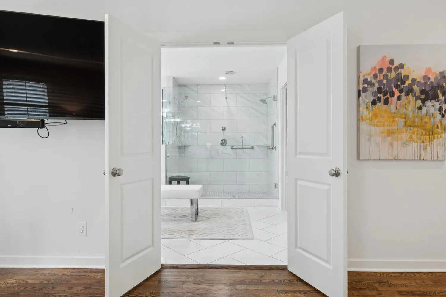 a bathroom with a tub sink and mirror
