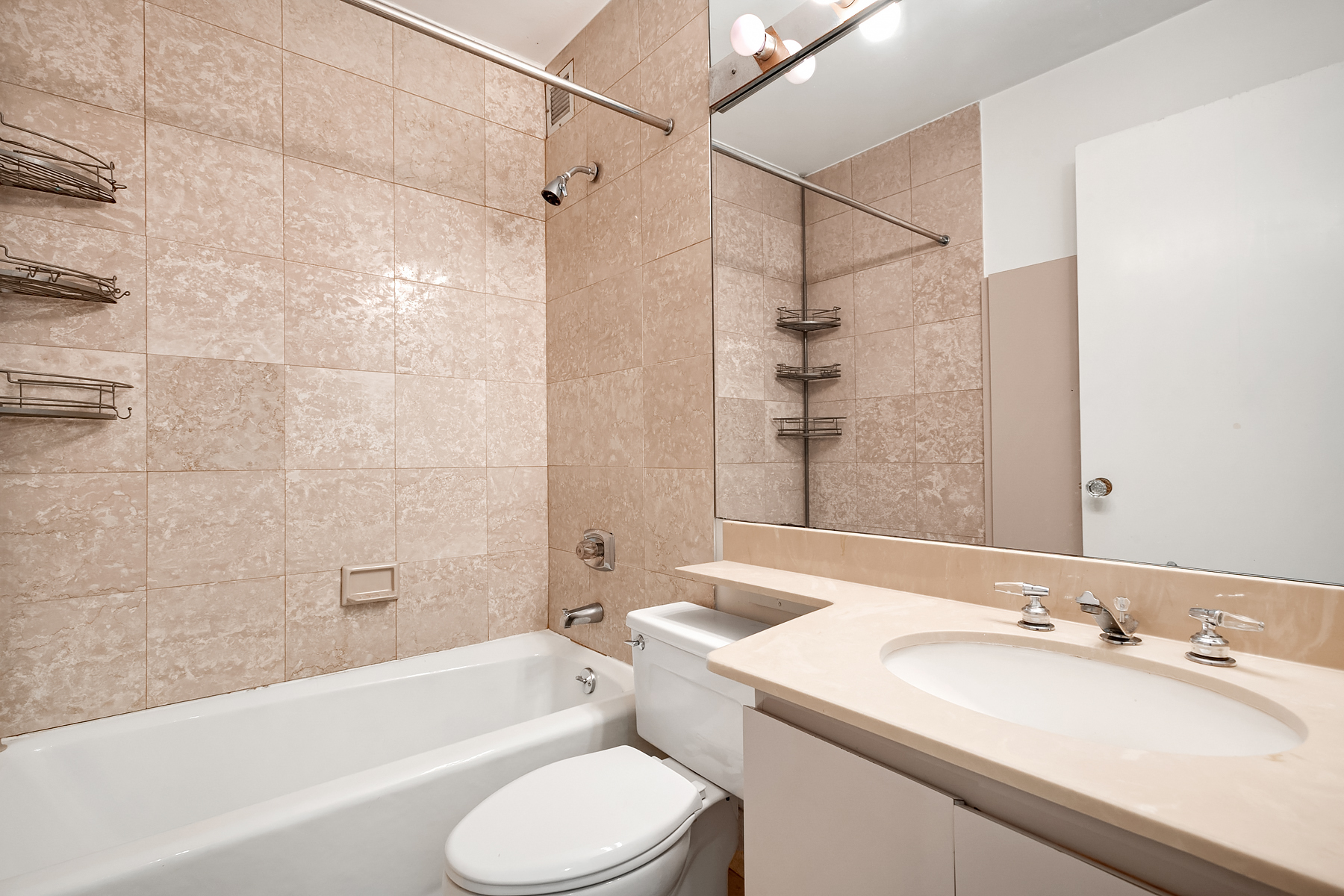 330 East 75th Street, Unit 3L Manhattan, NY 10021 - Photo 12 of 14 a bathroom with a sink toilet bathtub and shower