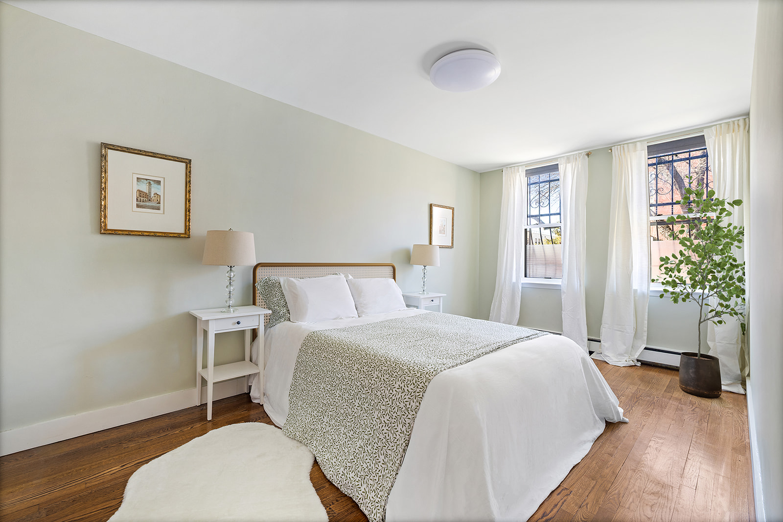 118 Union Street, Unit 9A Brooklyn, NY 11231 - Photo 4 of 10 a bedroom with a bed and a potted plant