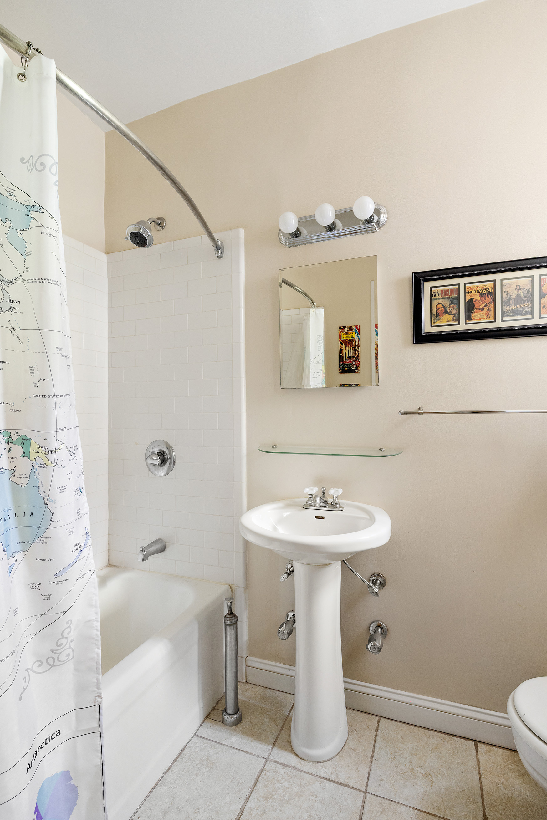 34-24 82nd Street, Unit 2B Queens, NY 11372 - Photo 7 of 8 a bathroom with a sink a toilet and shower