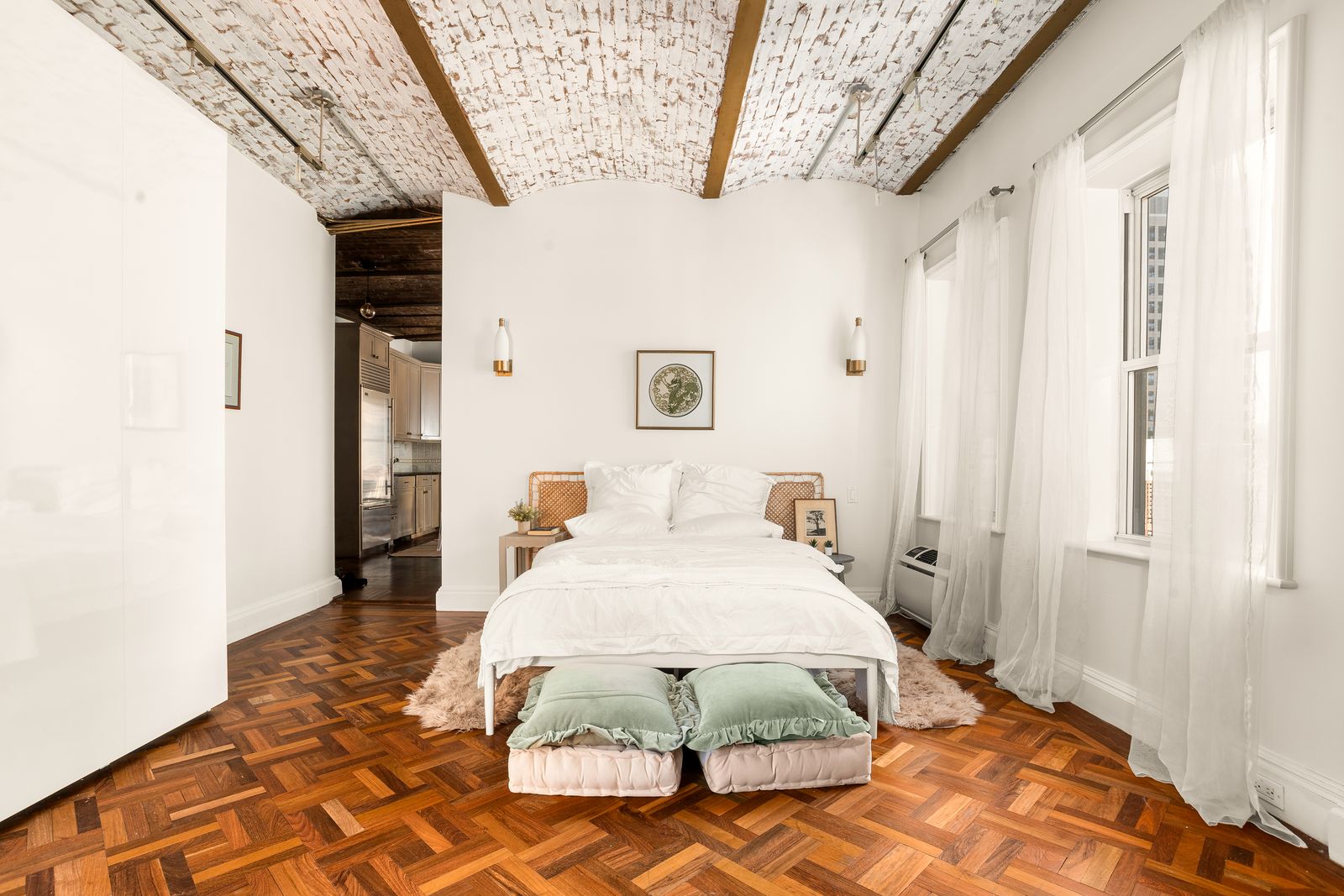 205 West 57th Street, Unit 11DB Manhattan, NY 10019 - Photo 7 of 10 a bedroom with a bed and a mirror