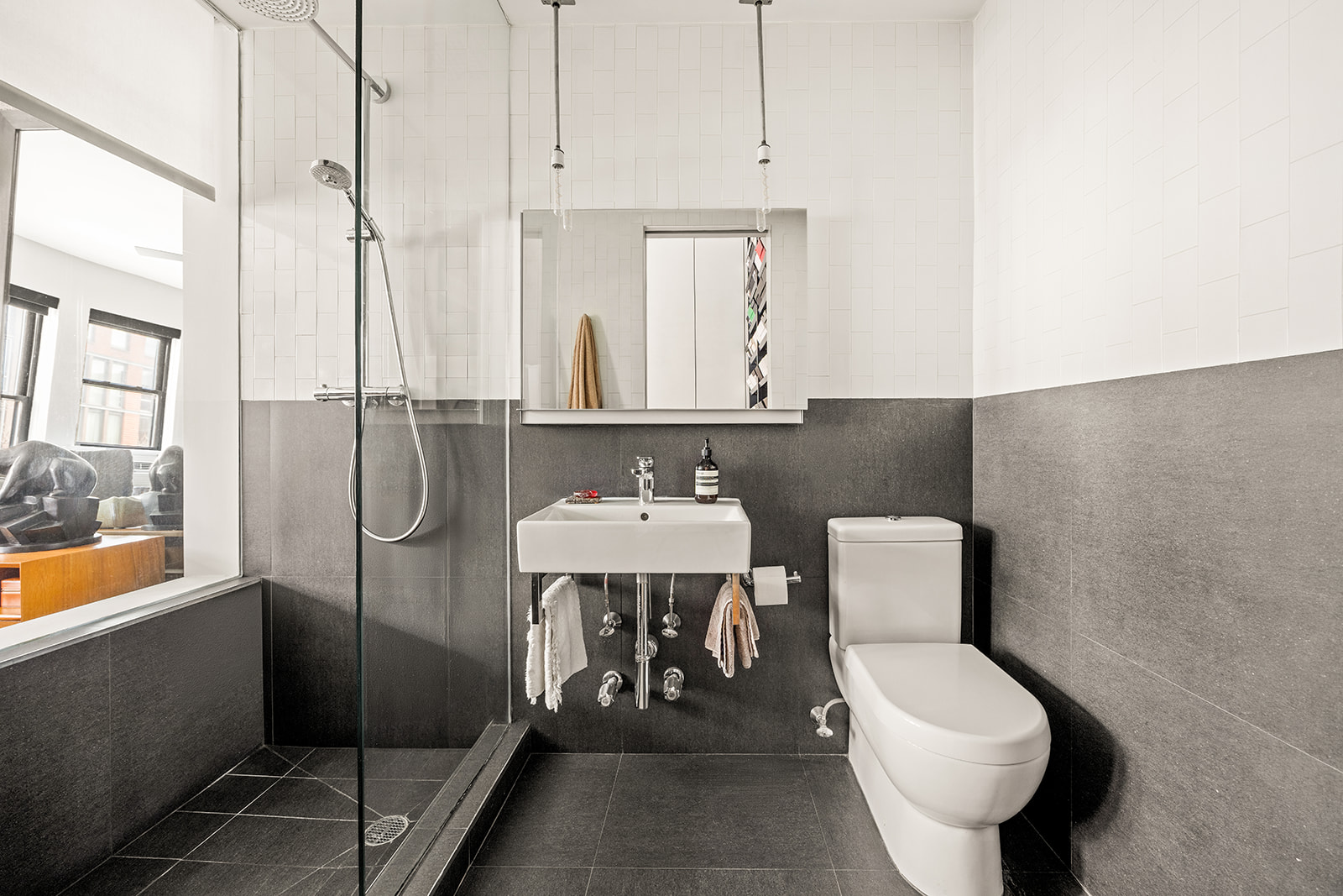 360 West 21st Street, Unit 2DE Manhattan, NY 10011 - Photo 5 of 9 a bathroom with a toilet a sink and bathtub