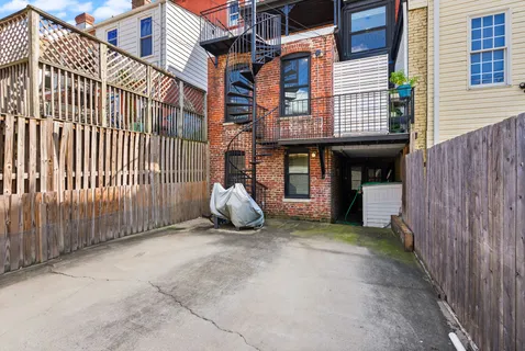 a view of a building with a street