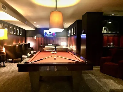 a room with table chairs and a projector