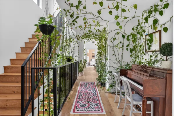 a view of entryway with wooden floor