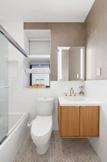 a bathroom with a toilet a sink and bathtub