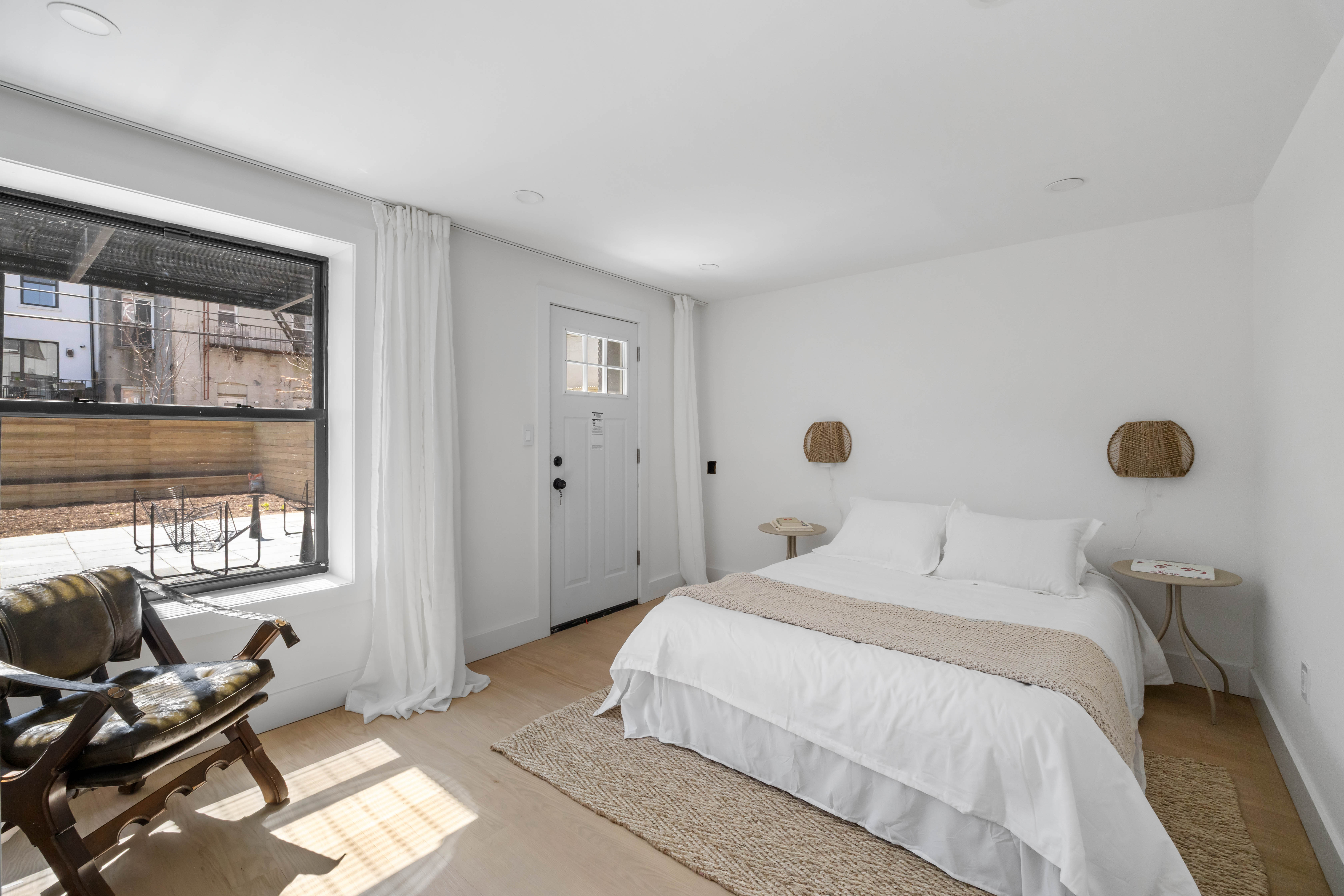 1000 Putnam Avenue Brooklyn, NY 11221 - Photo 13 of 18 a bedroom with a bed and wooden floor