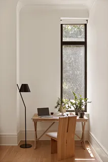 a view of a workspace room with table and chairs