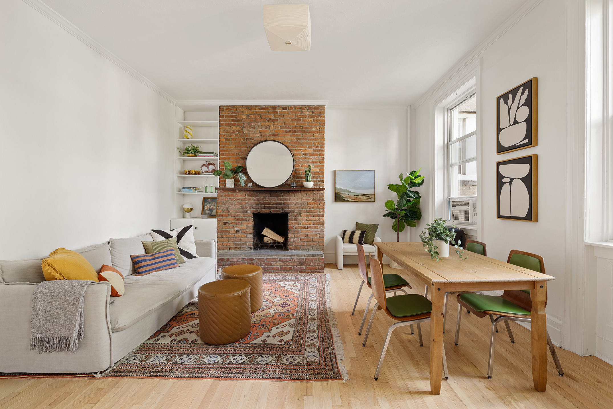 a living room with furniture a fireplace and a table