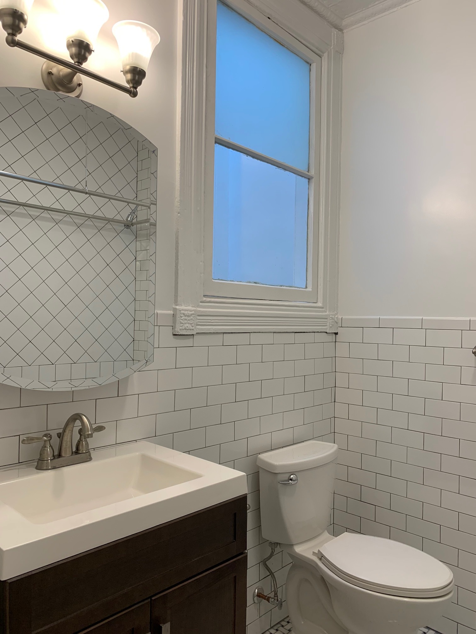 481 9th Street, Unit 4 Brooklyn, NY 11215 - Photo 21 of 33 a bathroom with a sink a toilet and mirror
