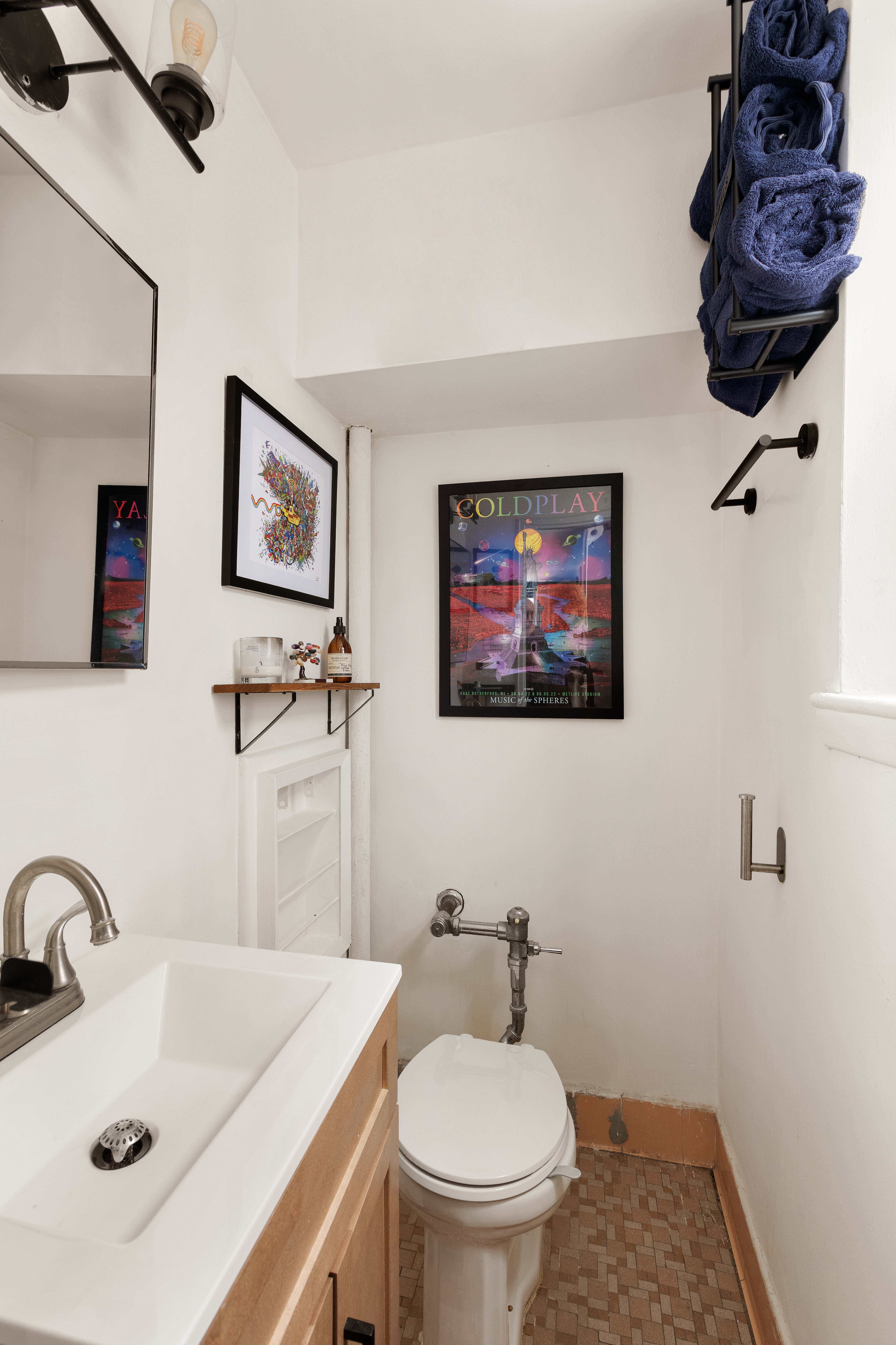 495 East 7th Street, Unit 2F Brooklyn, NY 11218 - Photo 6 of 10 a bathroom with a sink a toilet and mirror