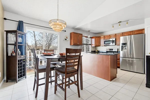 a kitchen with stainless steel appliances granite countertop a stove sink and cabinets
