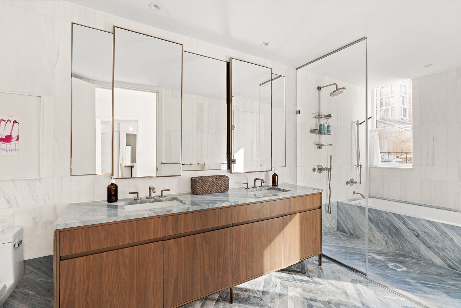 150 East 23rd Street, Unit 5D Manhattan, NY 10010 - Photo 5 of 12 a bathroom with a double vanity sink and mirror