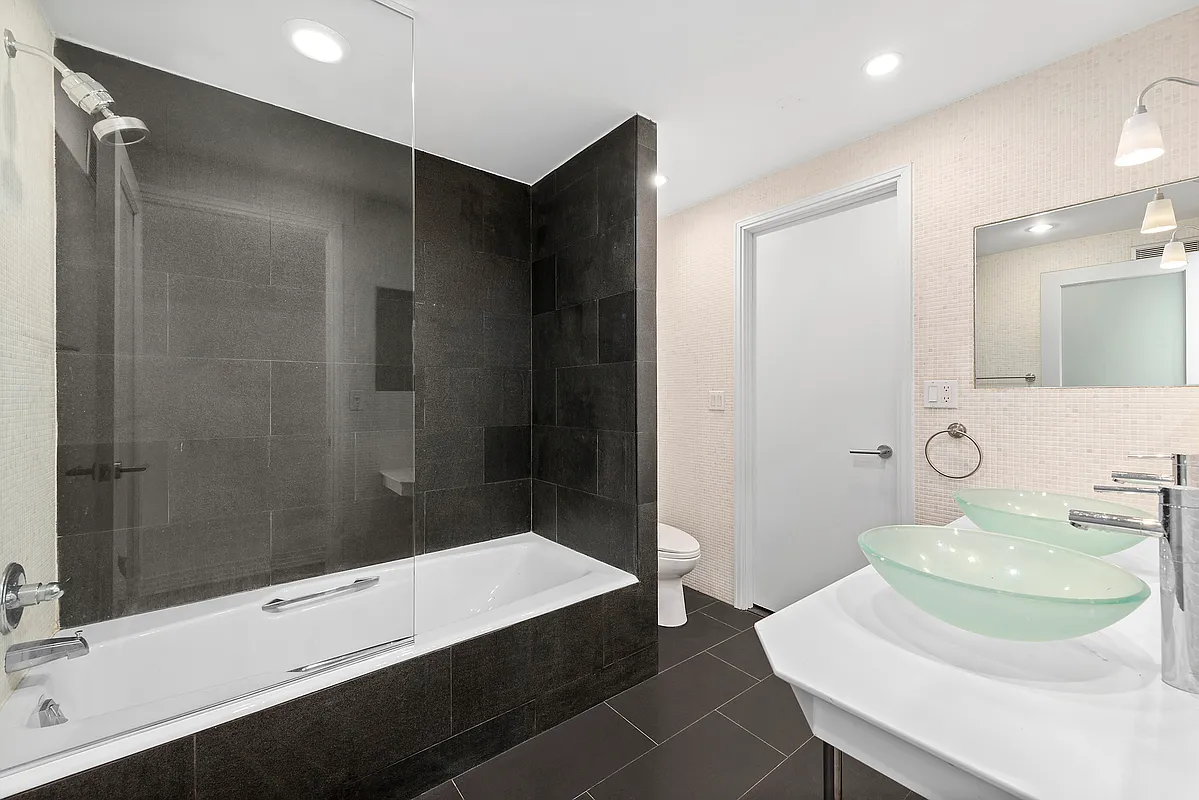 53 Murray Street, Unit G Manhattan, NY 10007 - Photo 6 of 12 a bathroom with a sink and a mirror