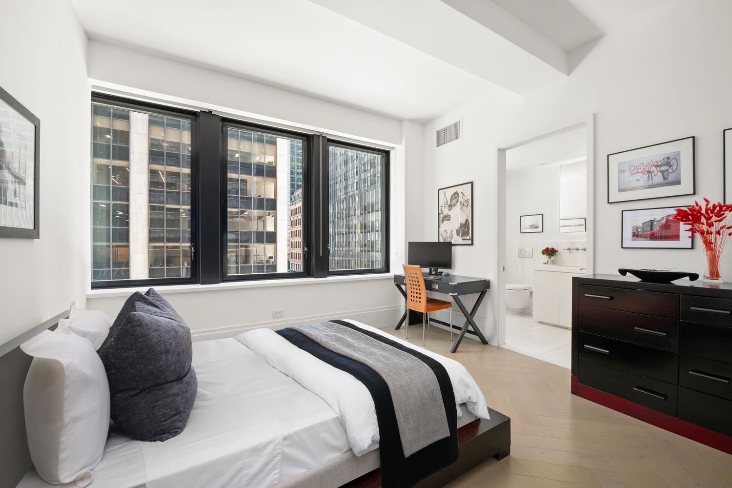 101 Wall Street, Unit 5BE Manhattan, NY 10005 - Photo 5 of 16 a bedroom with a bed and a large window