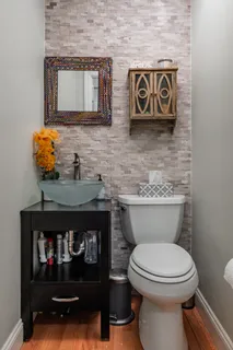 a bathroom with a toilet and a sink