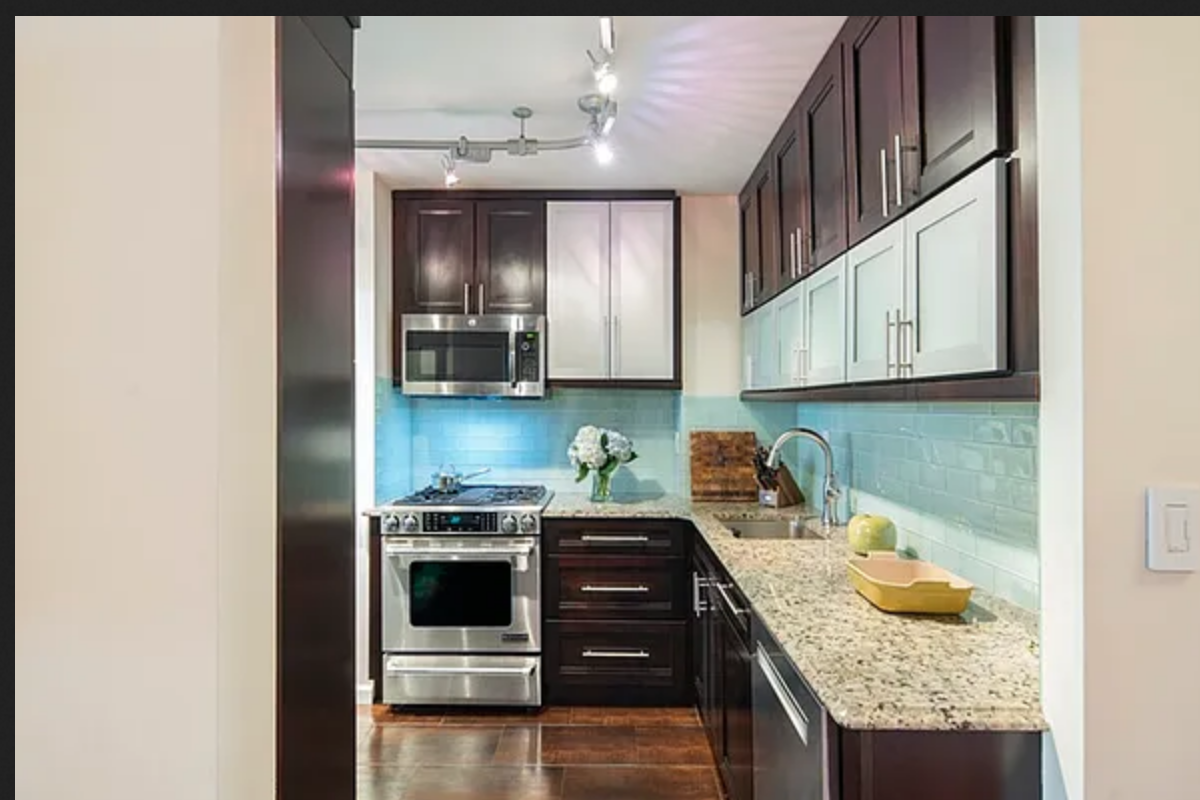 255 West 85th Street, Unit 7A Manhattan, NY 10024 - Photo 5 of 7 a kitchen with stainless steel appliances granite countertop a stove and cabinets