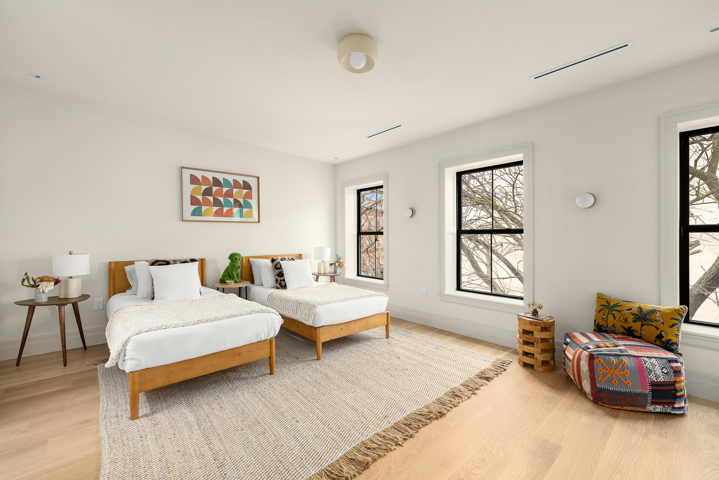 167 Quincy Street Brooklyn, NY 11216 - Photo 14 of 20 a spacious bedroom with a bed and a couch