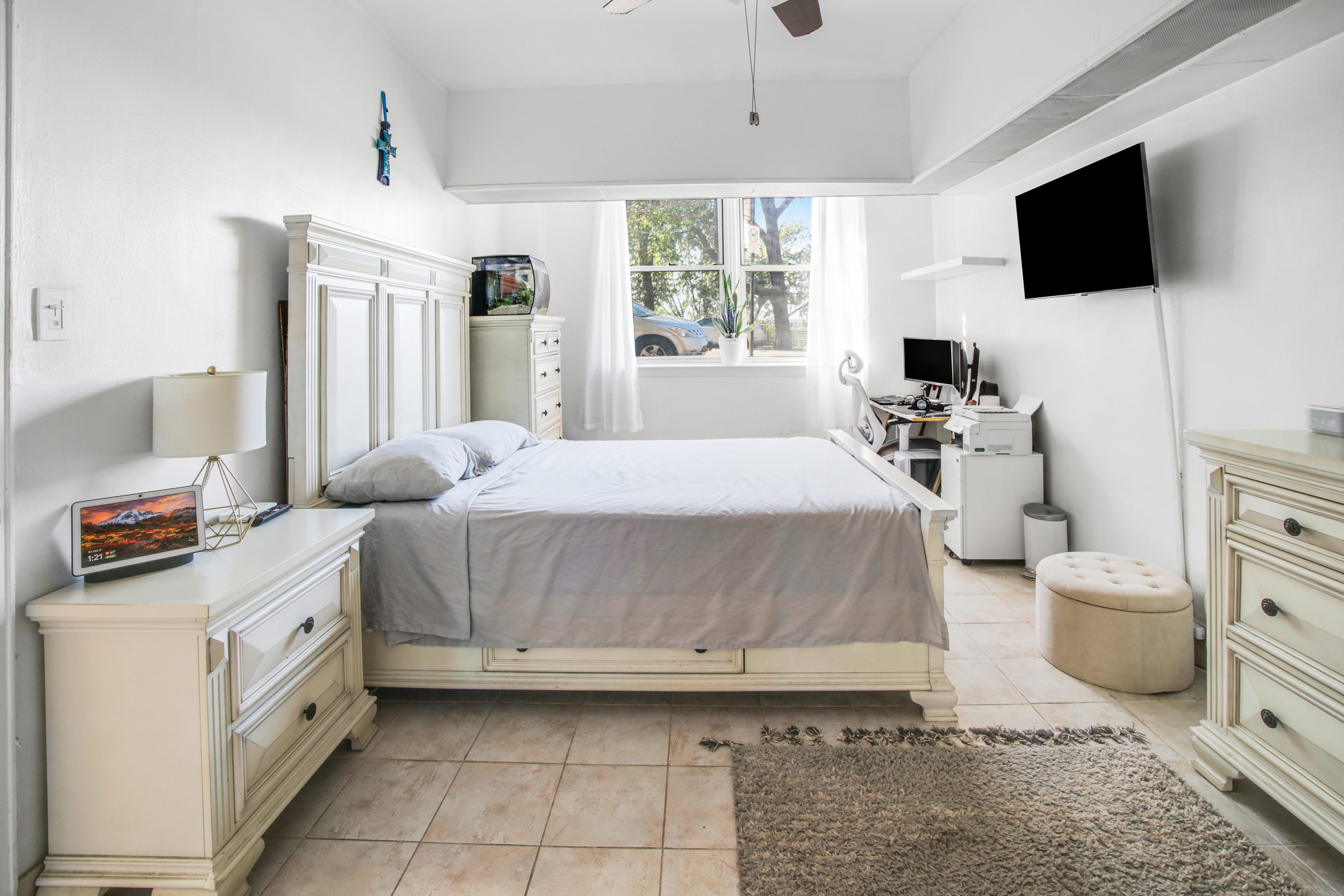 9801 Shore Road, Unit BB Brooklyn, NY 11209 - Photo 7 of 13 a bedroom with a bed and a flat screen tv