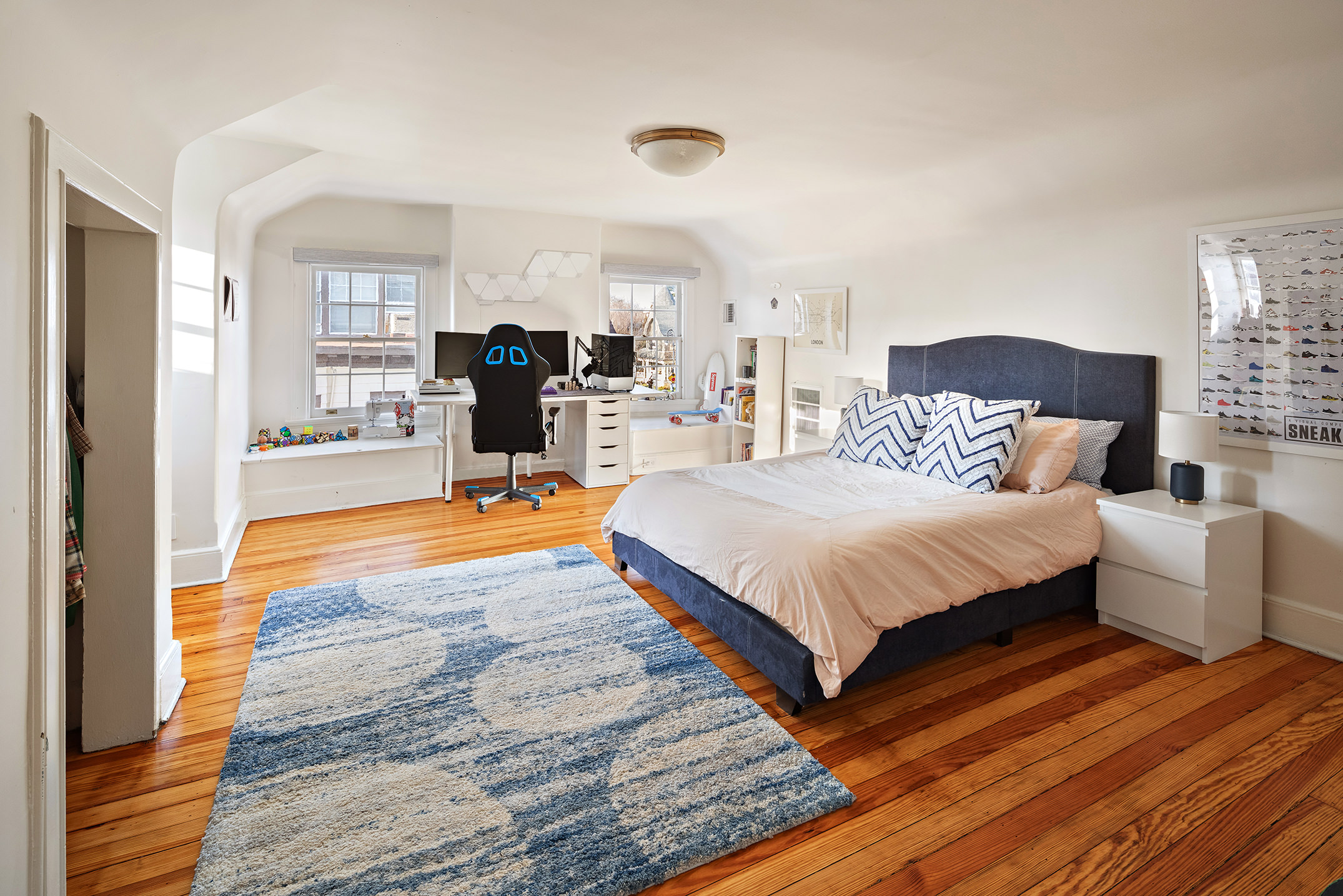 162 Argyle Road Brooklyn, NY 11218 - Photo 18 of 25 a spacious bedroom with a bed and wooden floor