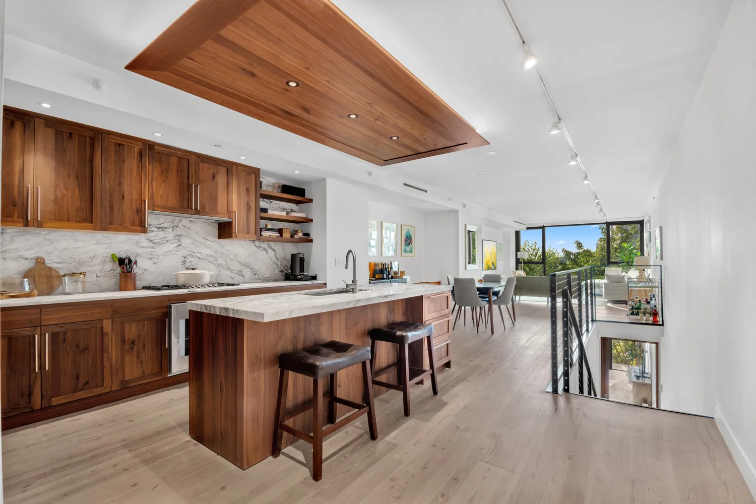 a kitchen with lots of wooden furniture a sink appliances and cabinets