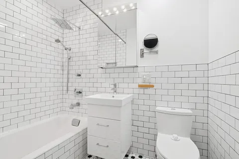 a bathroom with a toilet and a sink