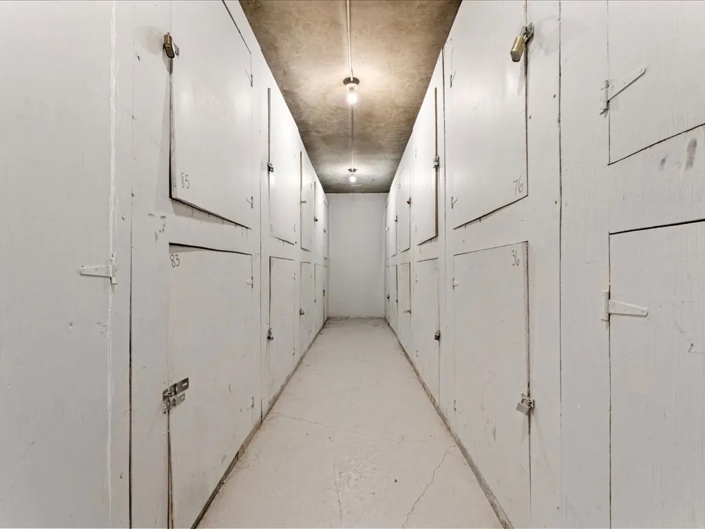 a view of a hallway with white walls