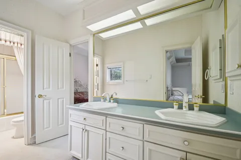 a bathroom with a sink double vanity and a mirror