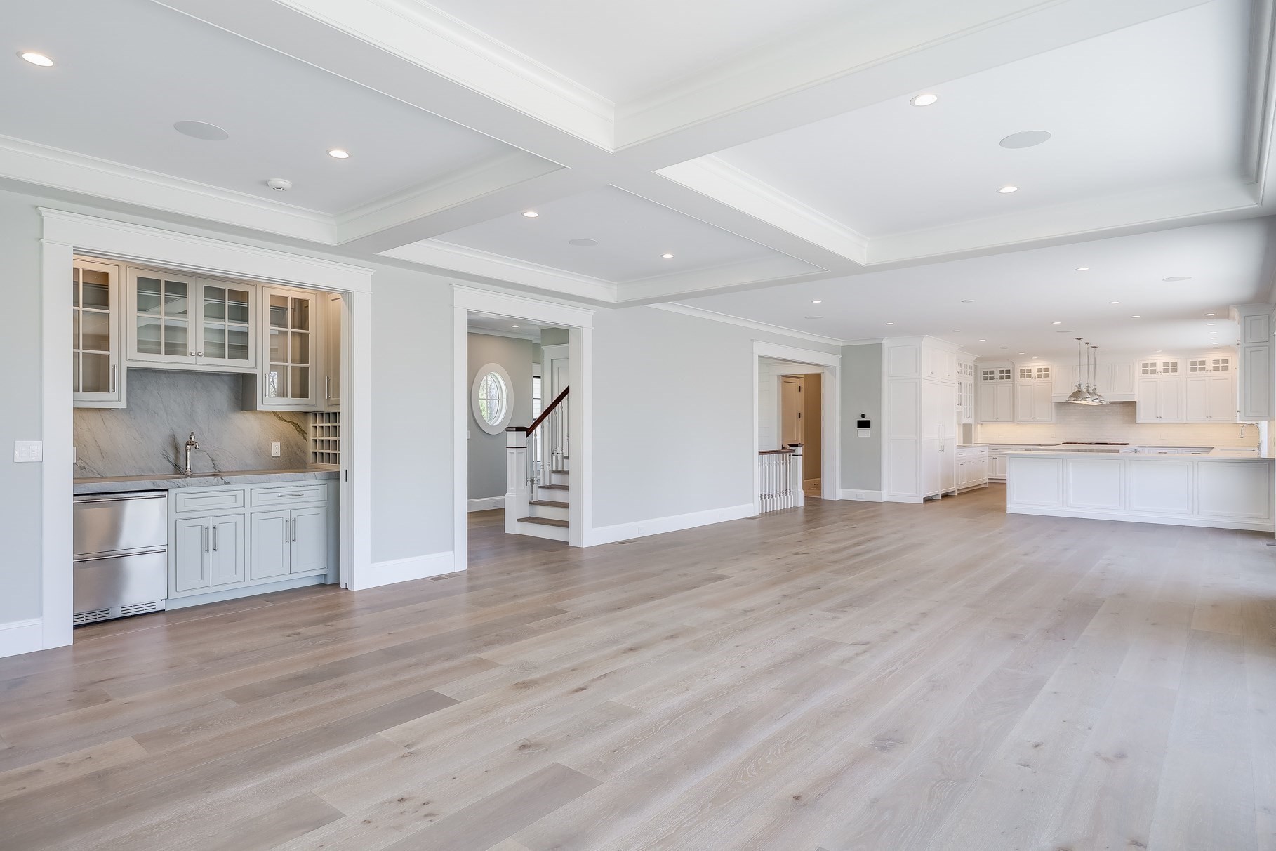 181 Dedham Street Dover, MA 02030 - Photo 5 of 19 a view of empty room with wooden floor and kitchen view