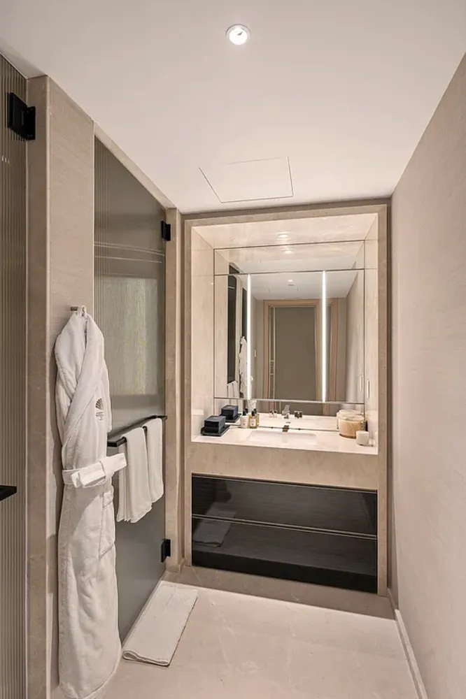 a bathroom with a double vanity sink and mirror