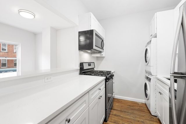 120 Smith Street, Unit 1 Brooklyn, NY 11201 - Photo 5 of 11 a view of a kitchen with a sink and a window