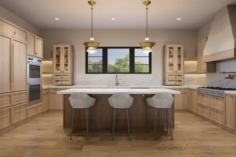 a kitchen with granite countertop a counter space dining table and stainless steel appliances