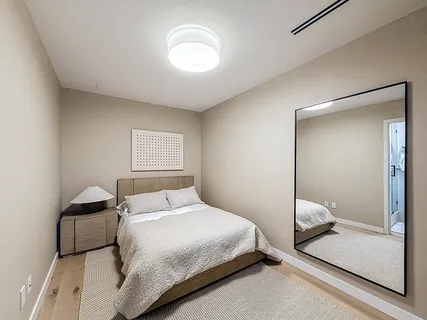 a view of a swimming pool with a bench and tables