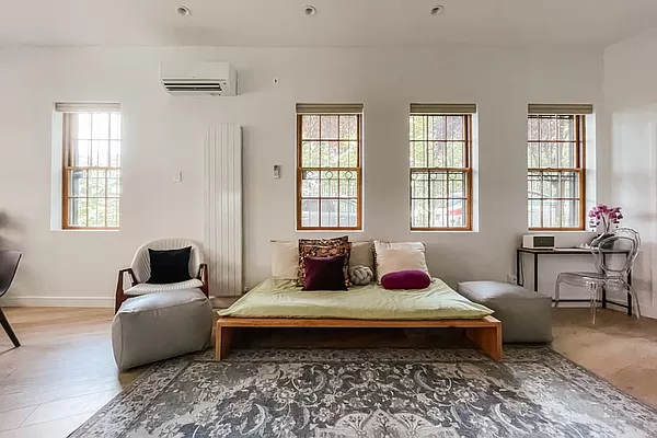 334 Plymouth Street Brooklyn, NY 11201 - Photo 20 of 32 a bedroom with a bed chair and window