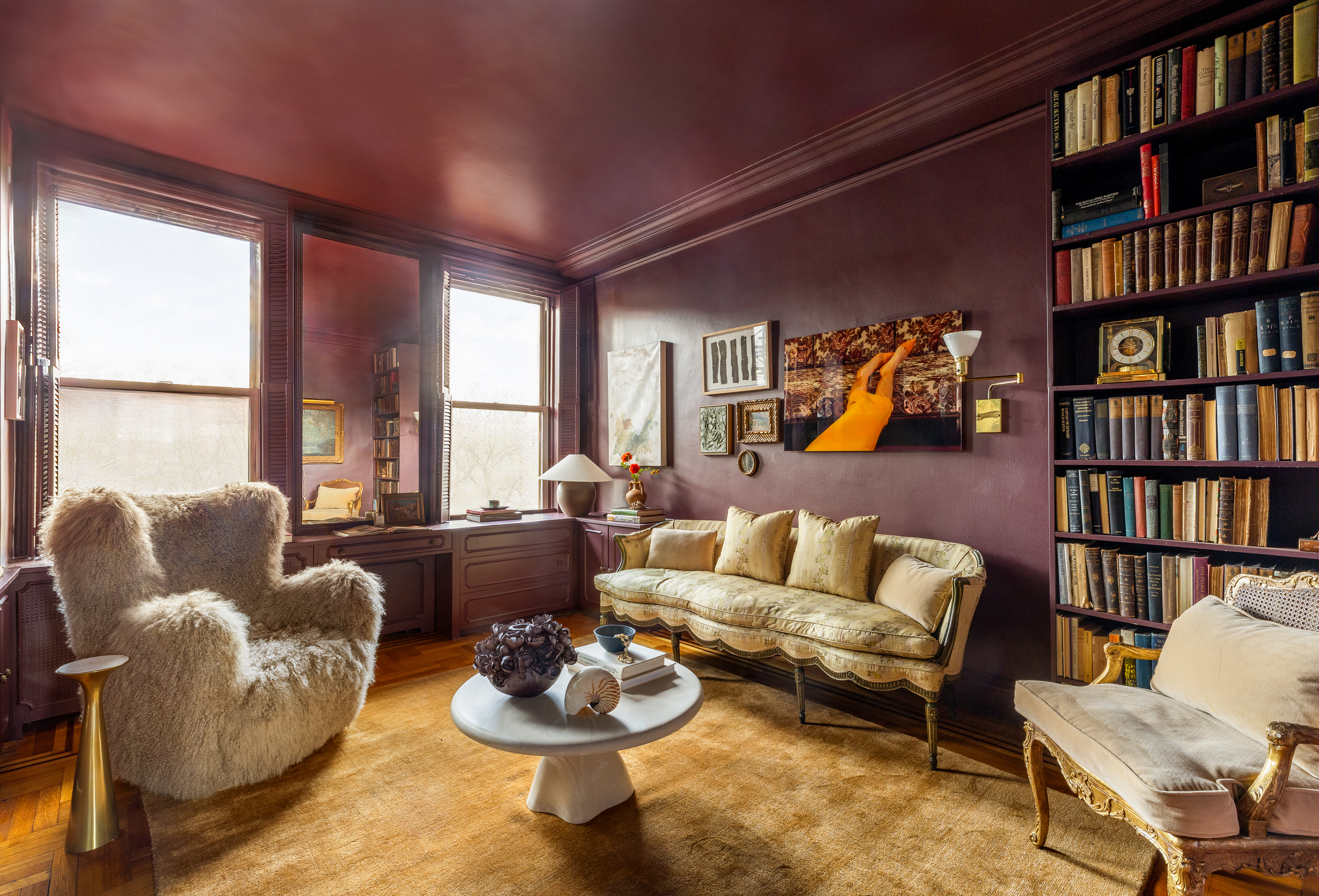 1136 5th Avenue, Unit 6A Manhattan, NY 10128 - Photo 34 of 44 a living room with furniture and a book shelf
