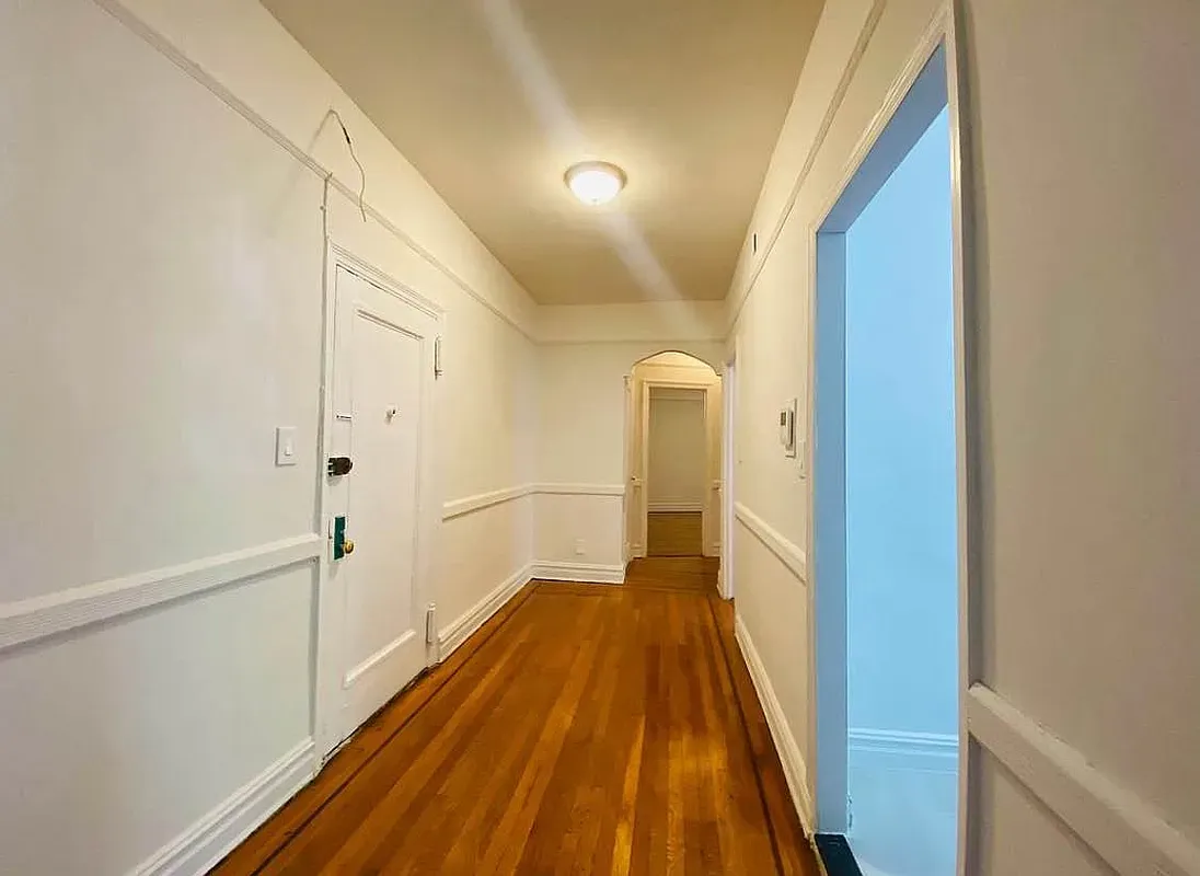 a view of a bathroom from the hallway