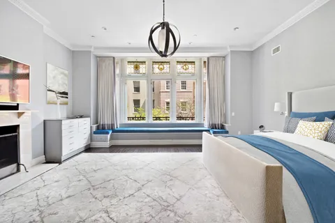 a bathroom with a double vanity sink a mirror and a bathtub