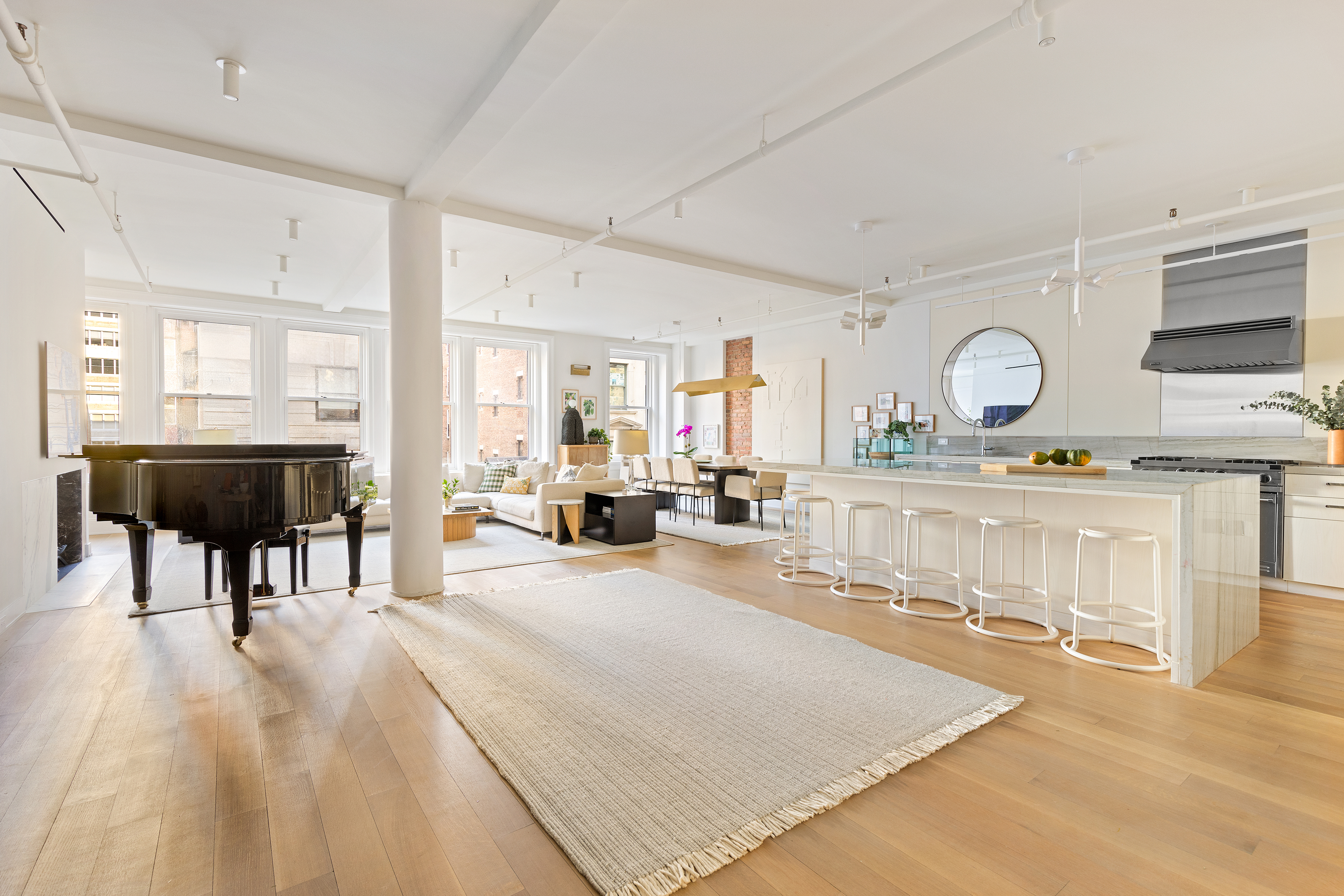 40 East 19th Street, Unit 7 Manhattan, NY 10003 - Photo 2 of 15 a living room with kitchen furniture and a table