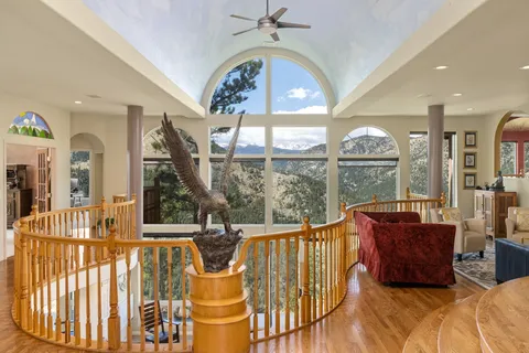 a view of balcony with wooden floor and lake view