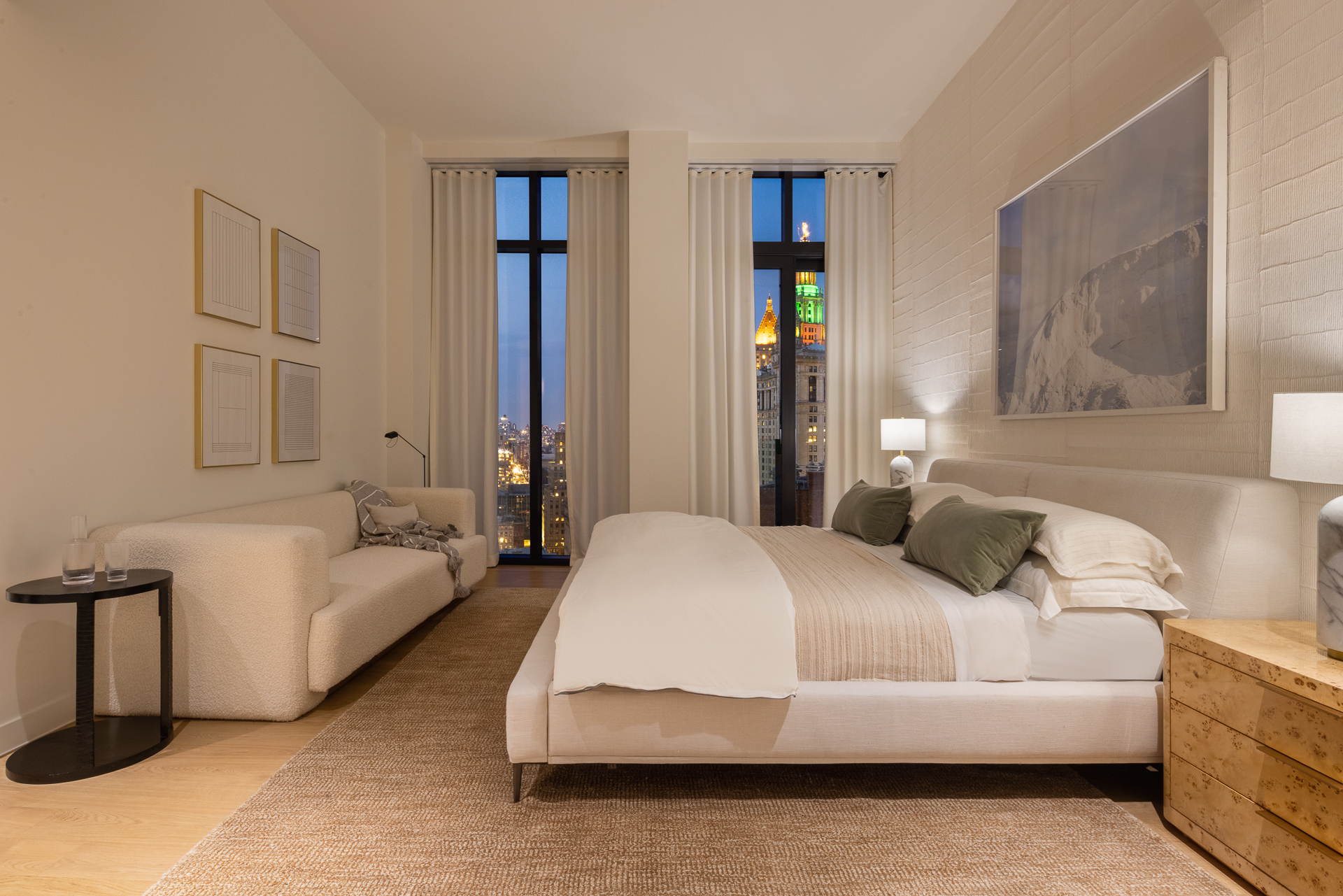 33 Park Row, Unit PH3 Manhattan, NY 10038 - Photo 14 of 30 a bedroom with a bed and a couch