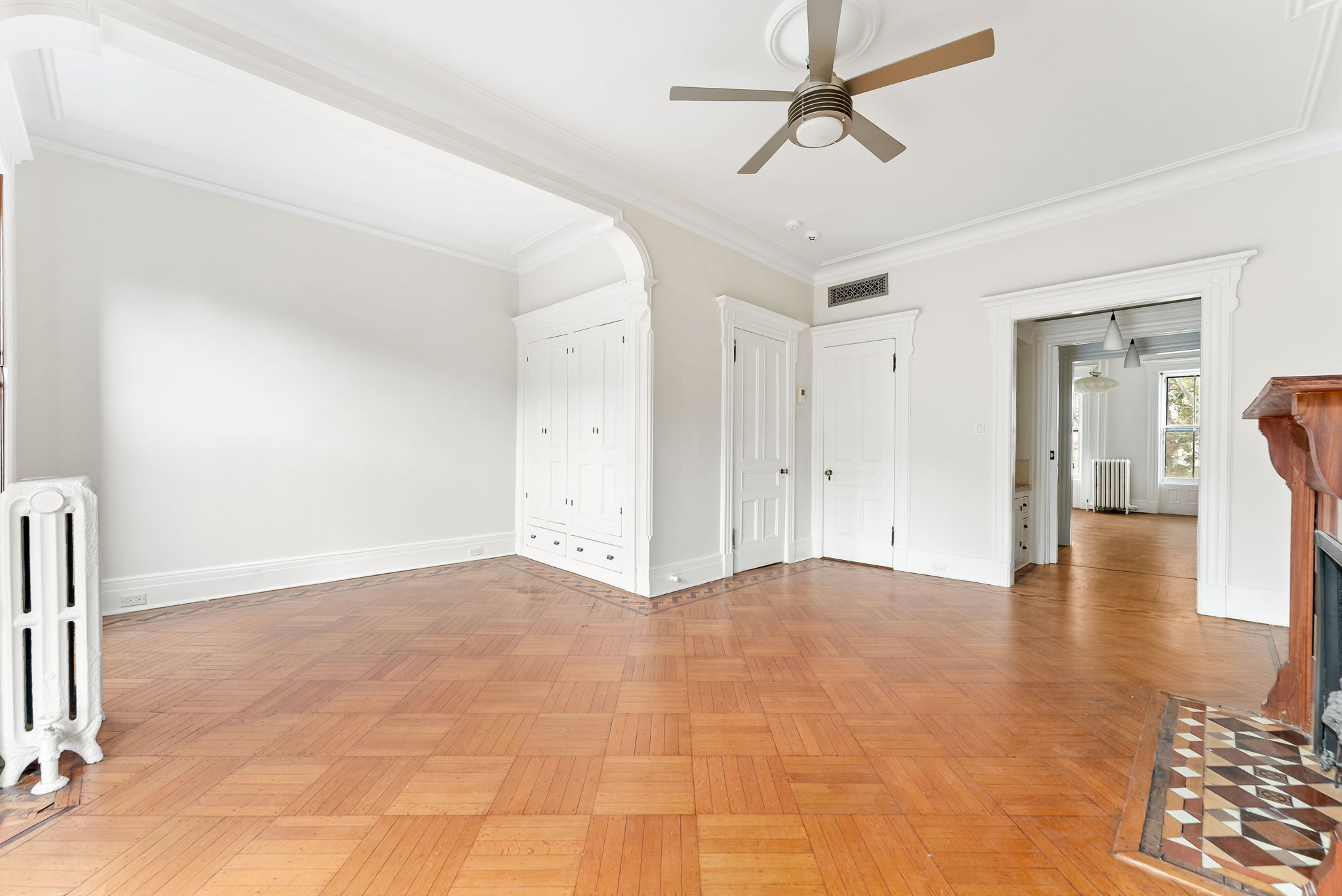 694 10th Street, Unit 2 Brooklyn, NY 11215 - Photo 8 of 22 a view of empty room with wooden floor and ceiling fan